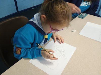 Tongue out in concentration, this Beaver is making sure her design is just right.