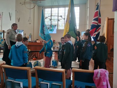 It's the end of the service, and the flagbearers and colour guards are ready to parade around the church's aisles and make their way out.