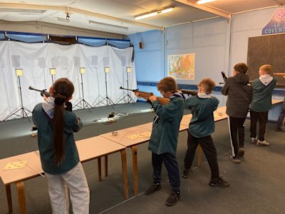 Scouts taking careful aim during their rifle competition.