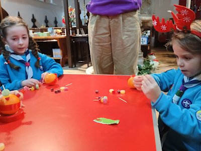 These Beavers are concentrating hard while they put their sweets onto their cocktail sticks. One is finding it easier than the other!