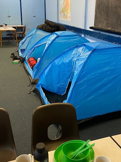 Three tents set up for the JOTA-JOTI sleepover. The dining area is in the foreground.