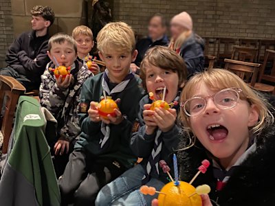 These five Cubs all look rather pleased with their Christingles. Some of them are making silly faces for the photo.