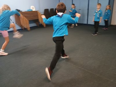 Two Beavers doing their silly walks. One of them is mid-stride in her imitation of John Cleese's long high stride.