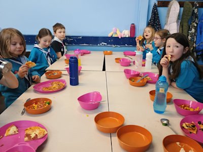 The Beavers are busy eating all the delicious salad and pizzas they made for themselves.