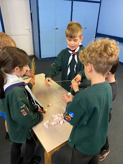 The Trackers Six busy working on their pioneering tower.