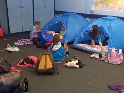 The Beavers are getting their beds set up for sleeping.