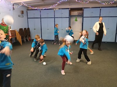 Looks like two of the Beavers decided to get their leader, as snowballs fly toward the camera. Two other Beavers are diving to grab a snowball to throw at someone else and several Beavers are chucking their snowballs at each other in the background.