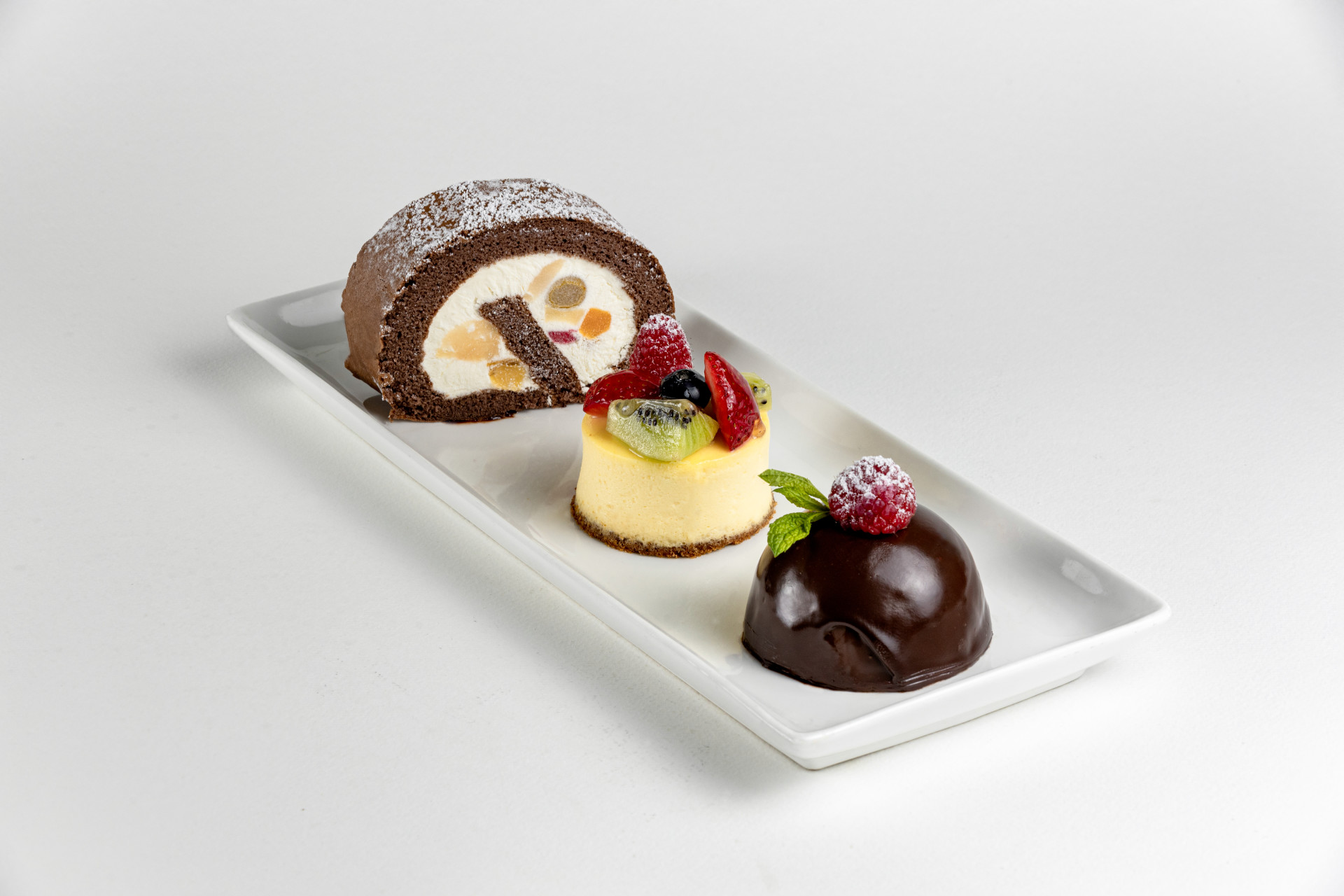 INDIVIDUAL DESSERTS- CHCOCOLATE DOME, FRUIT CHEESE CAKE, CHOCOLATE MIXED FRUIT SWISS ROLL (2)