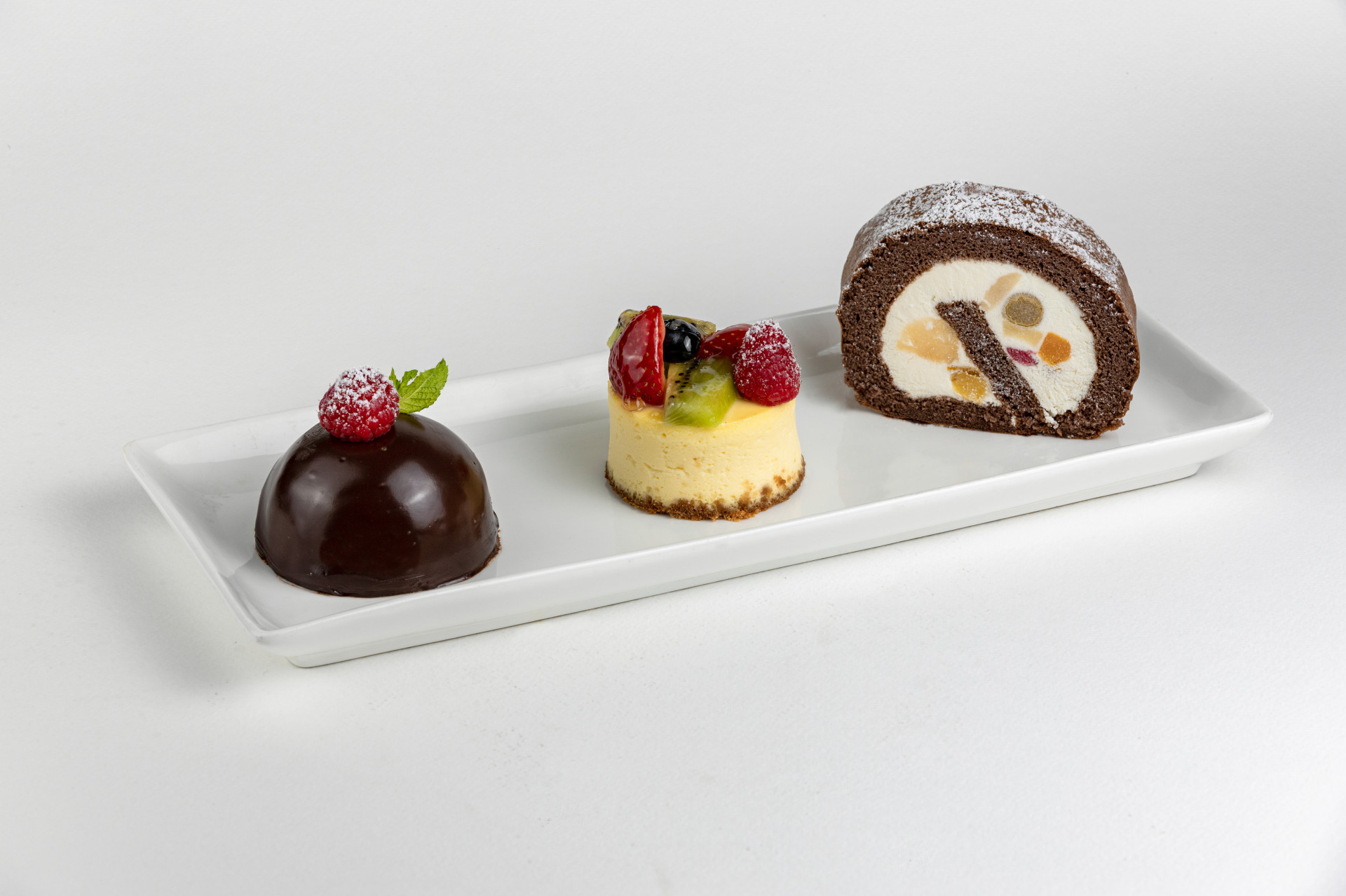 INDIVIDUAL DESSERTS- CHCOCOLATE DOME, FRUIT CHEESE CAKE, CHOCOLATE MIXED FRUIT SWISS ROLL