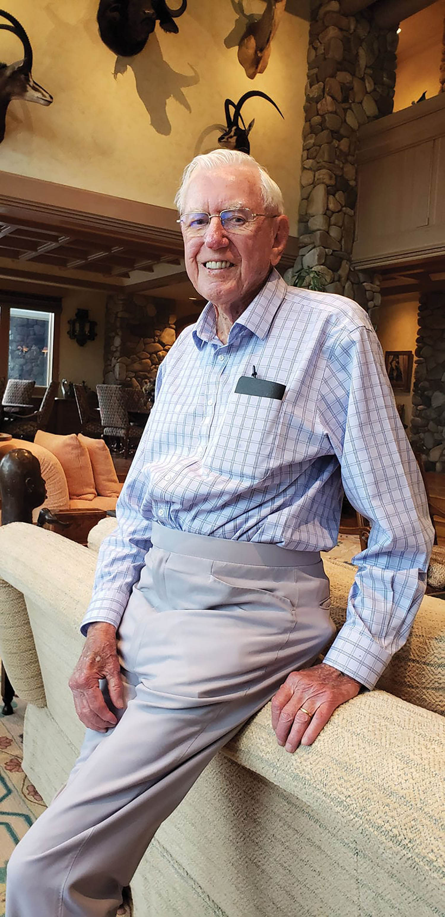 Photo of Harry Rinker leaning on a couch.