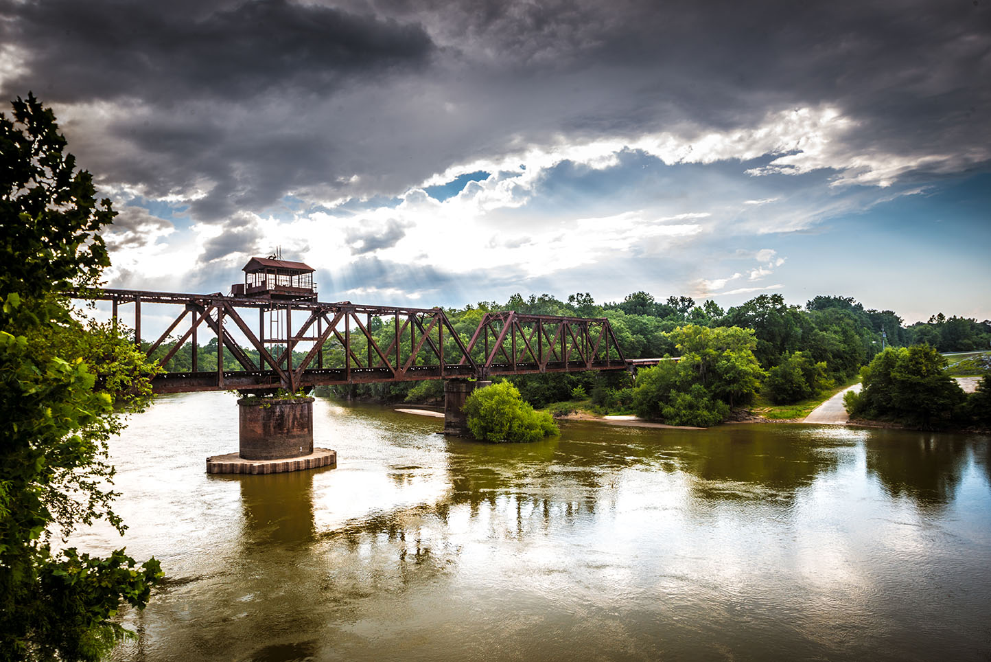 A beautiful view of a bridge going over a river. 