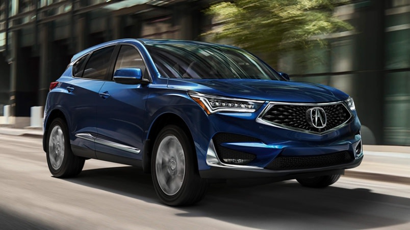 Blue Acura RDX in motion.