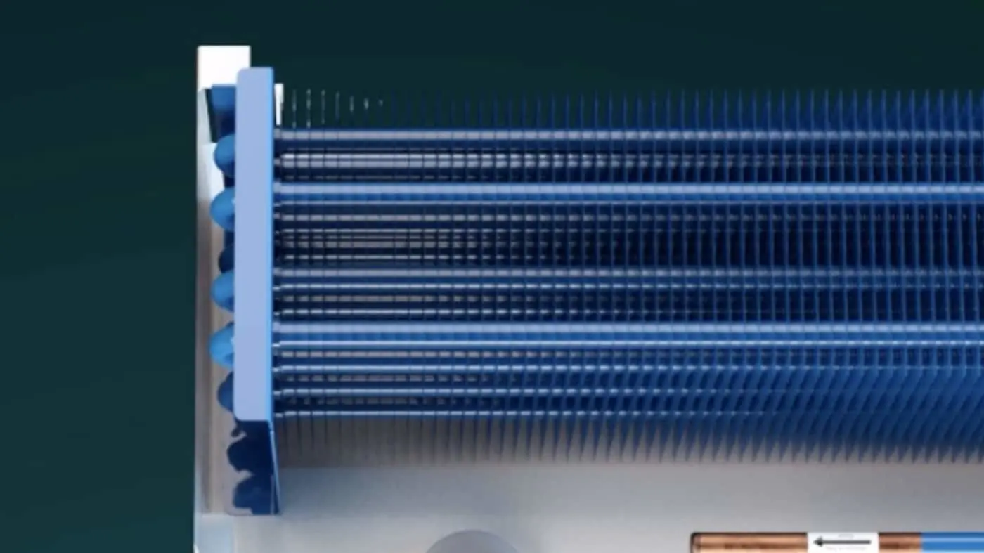 Blue metal heat exchanger with horizontal fins and vertical tubes on a dark teal background.