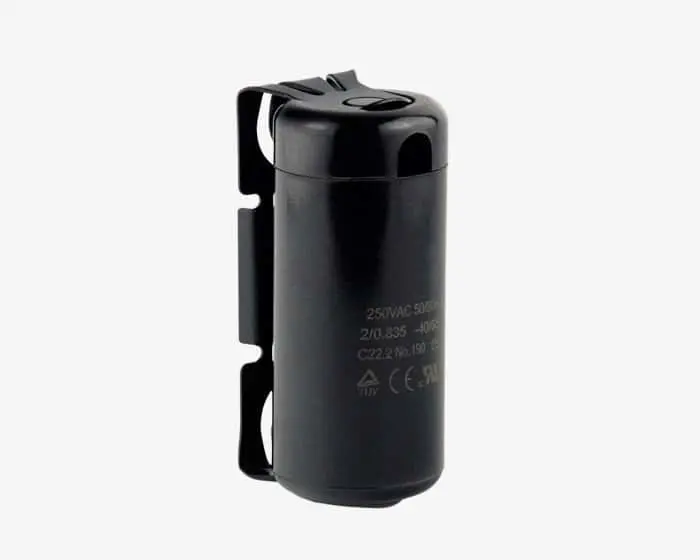 Black Tecumseh cylindrical capacitor with mounting bracket and technical specifications printed on the side