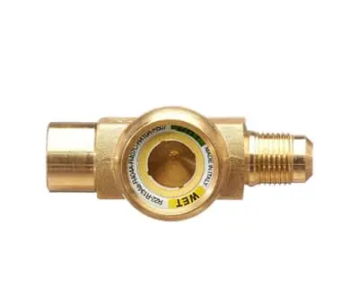 Brass fitting with threaded connections and a circular sight glass in the center showing internal flow path.