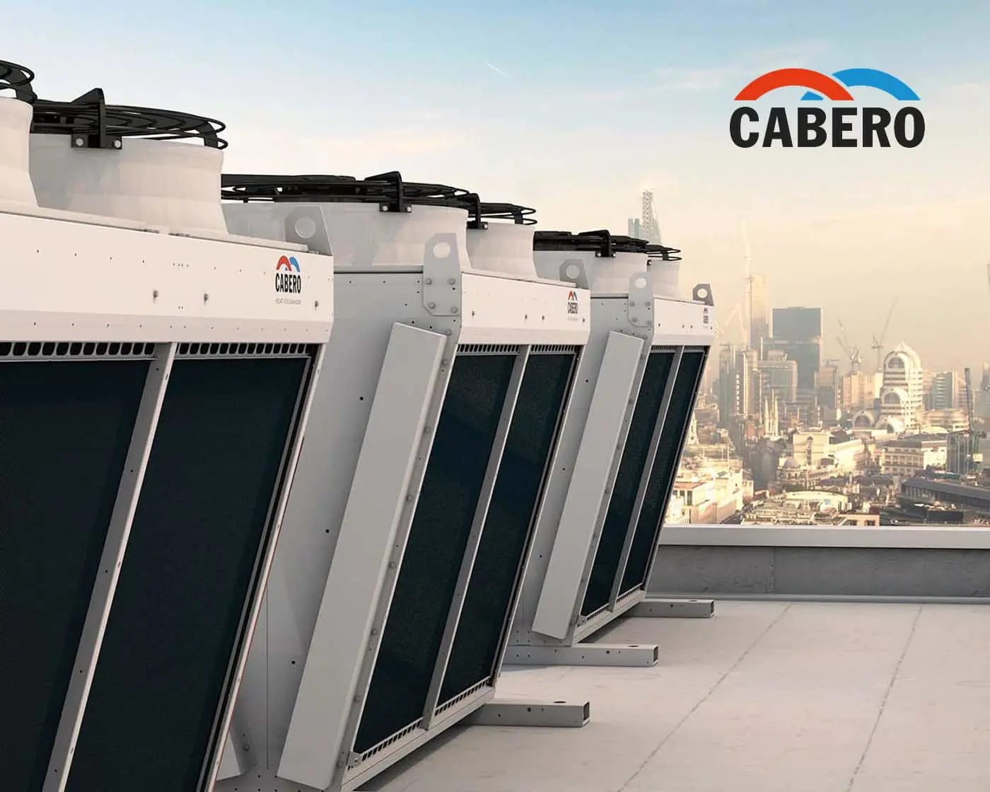 Row of Cabero industrial cooling units on a rooftop with city skyline in background and company logo visible.