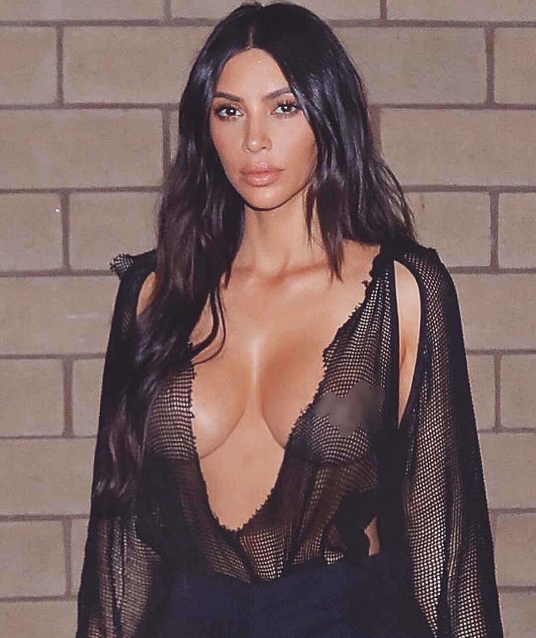 Only Kim can make a tattered fishnet top look so fashionable.