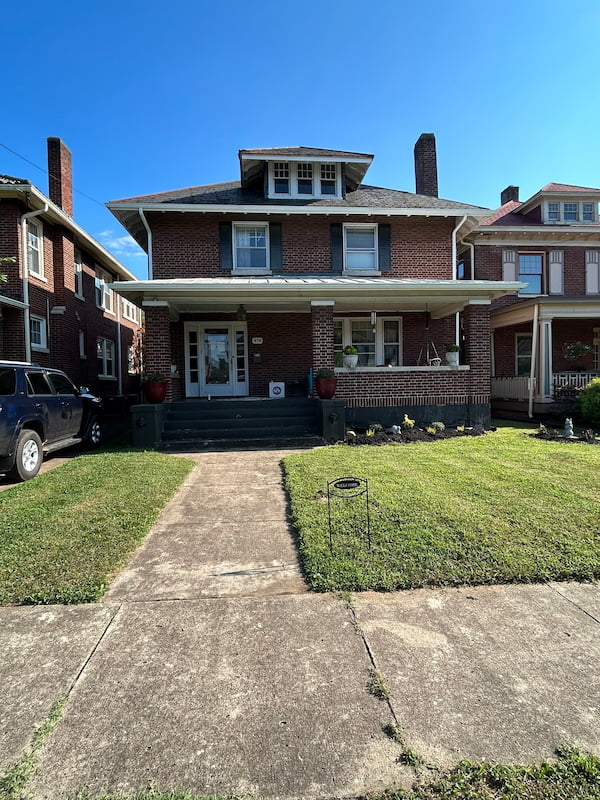 House after service with junk on porch removed