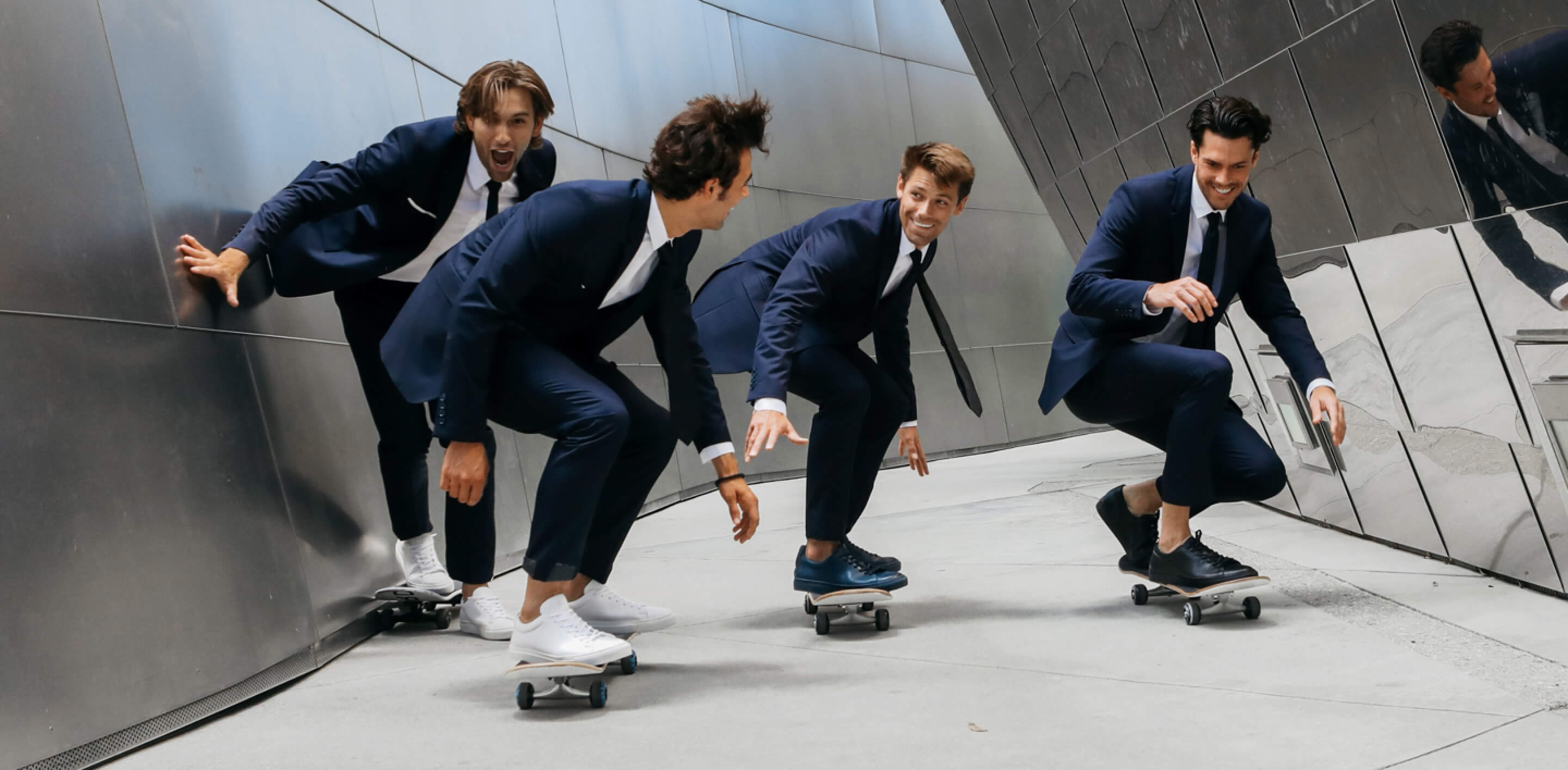 Men in suits skateboarding