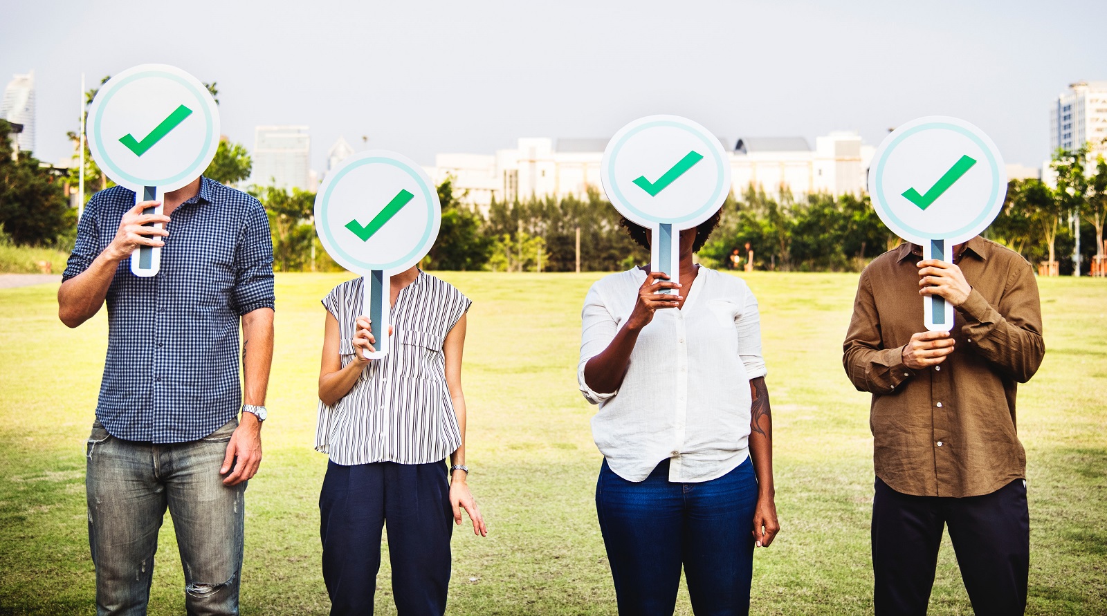 Group of people holding approval signs for customer service