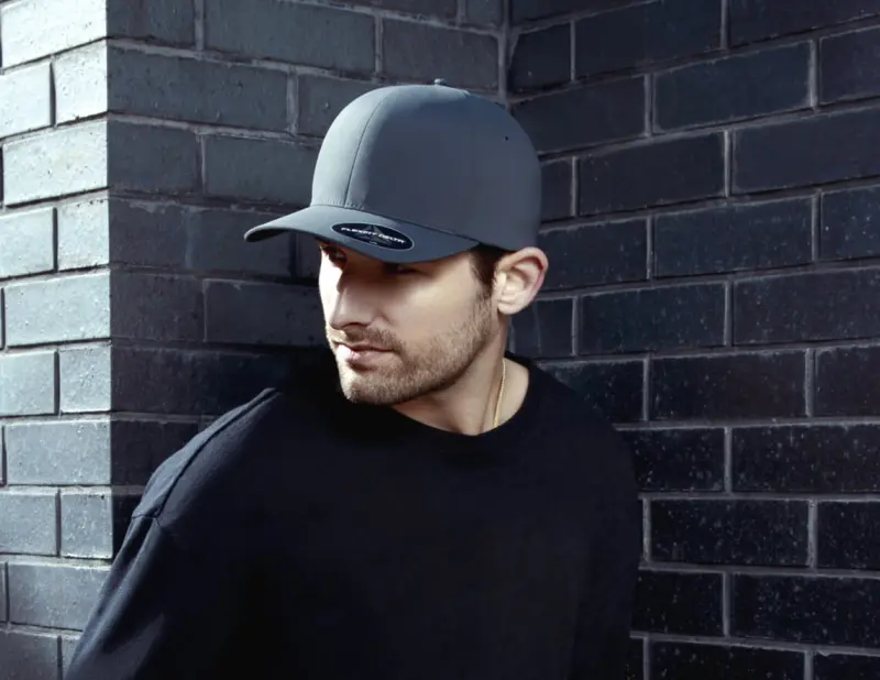 man wearing black flexfit cap
