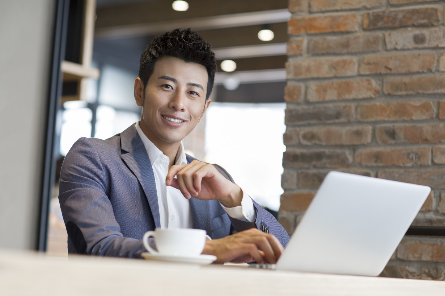 Man on laptop smiling