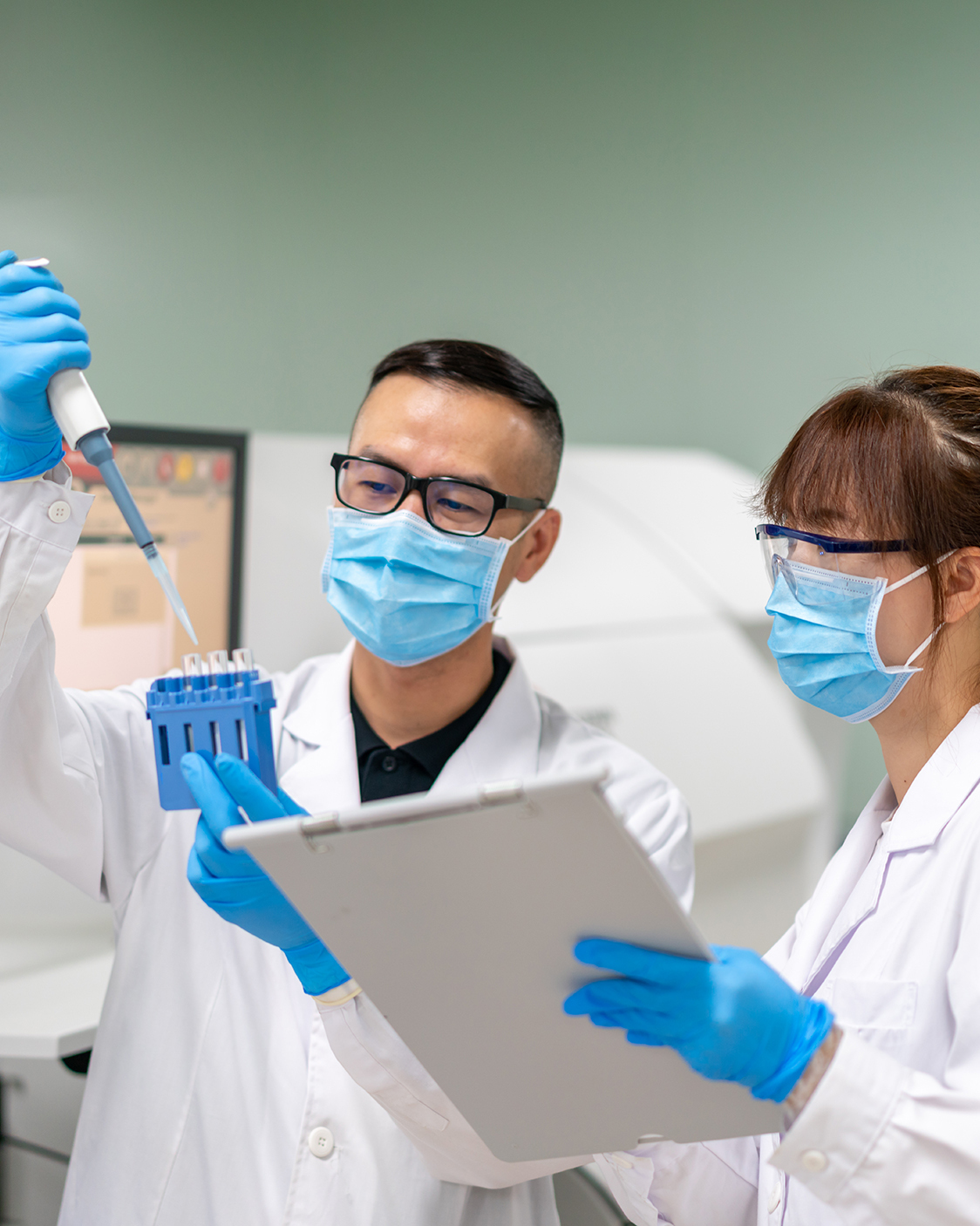 Male and female scientists working in a lab