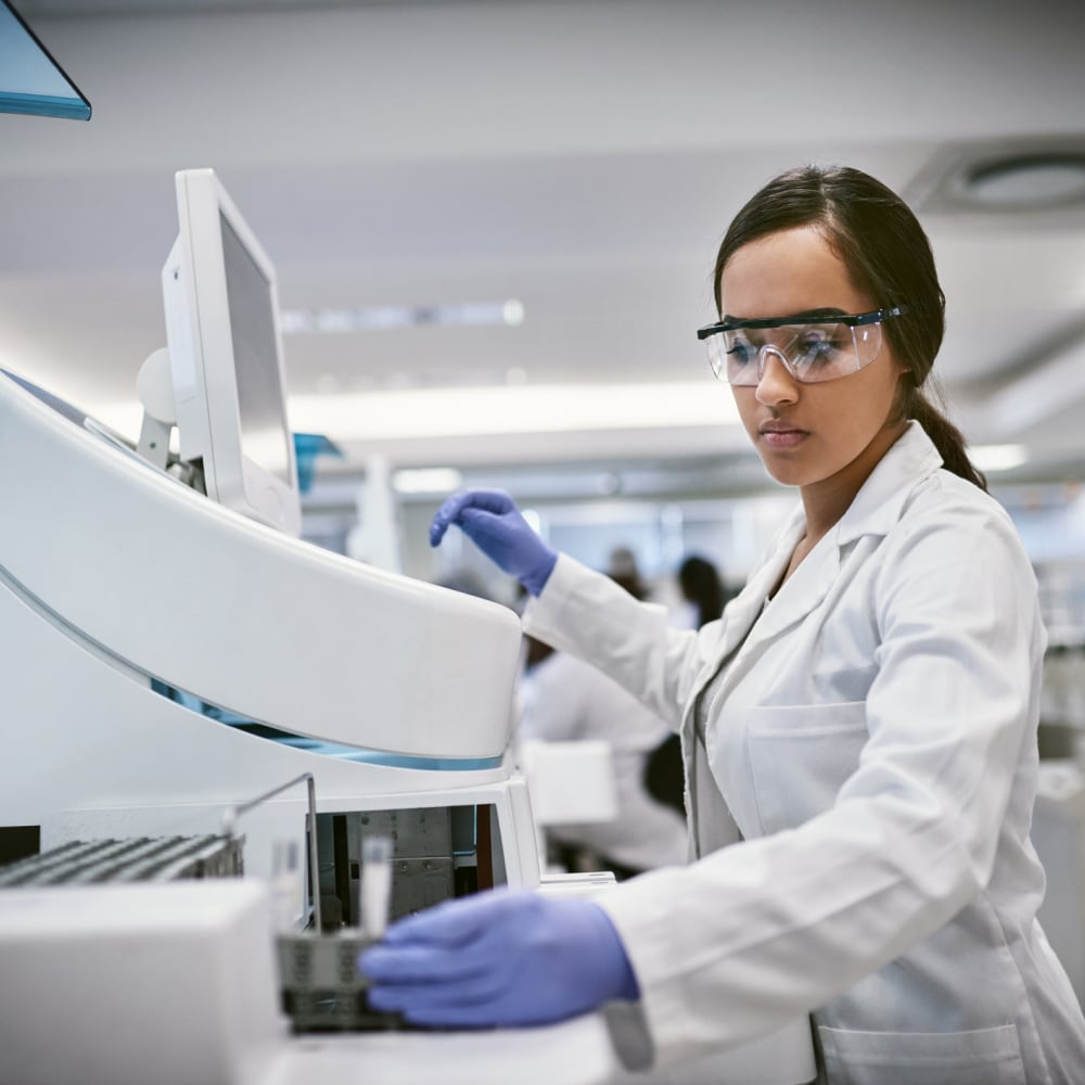 Scientist using lab machine