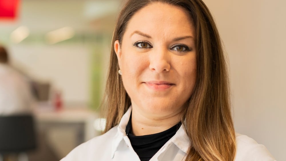 Woman scientist in lab coat portrait