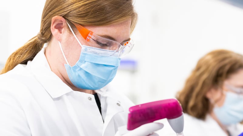 Moderna scientists performing laboratory tests
