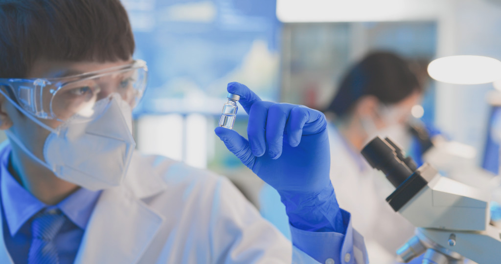 Scientist in the lab filling containers