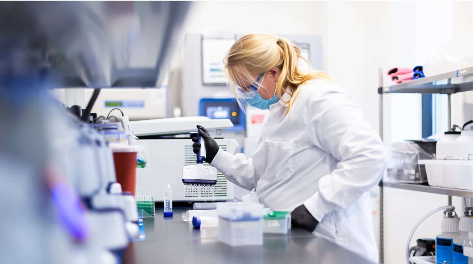 Scientist in the lab filling containers