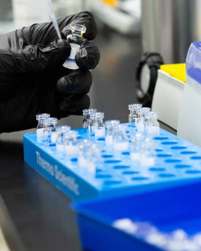 Close up of vials in blue container