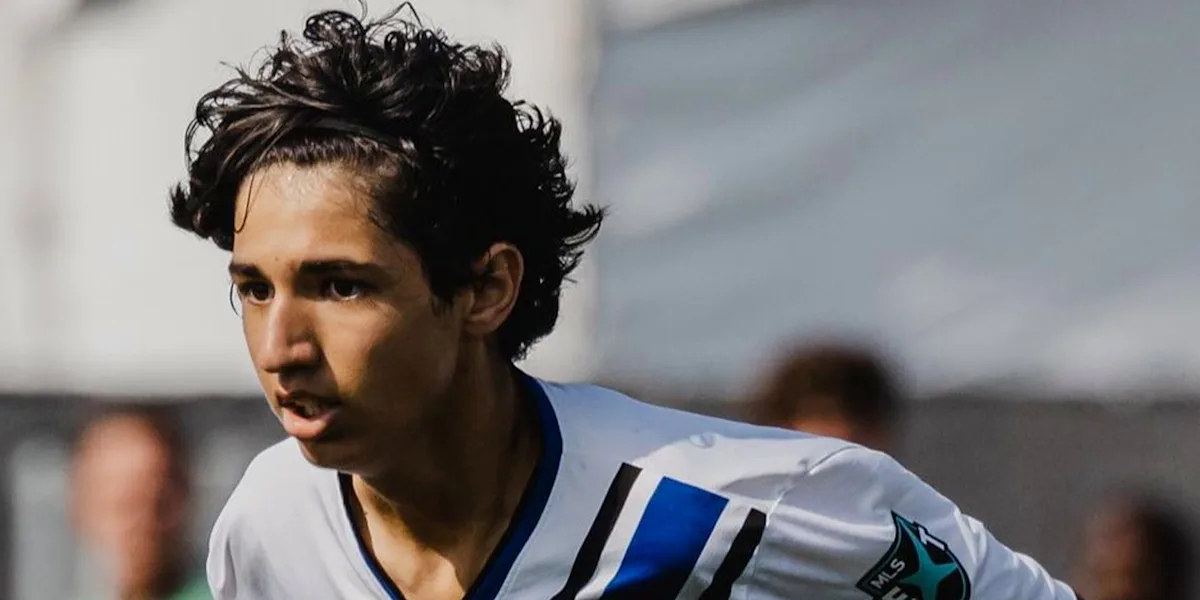 A football player looks intently across the field.