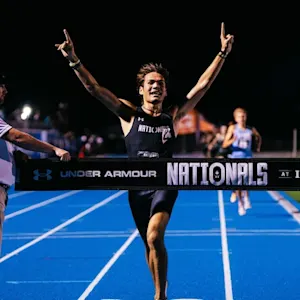 A track athlete celebrating a victory