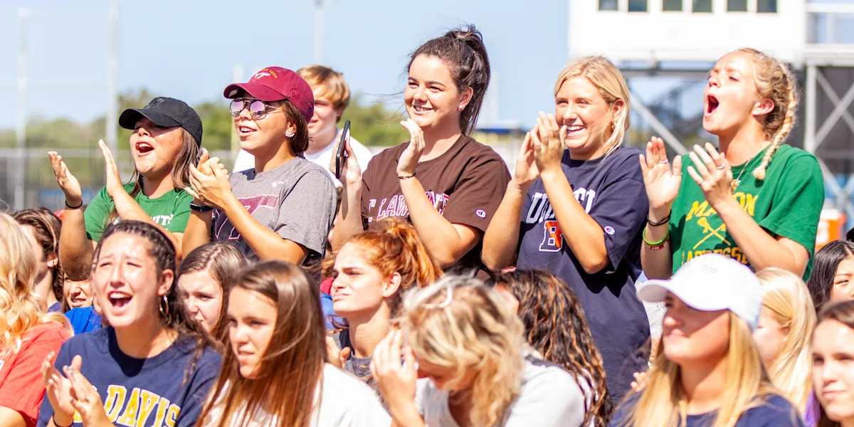 Spectators applaud and cheer from the stands.