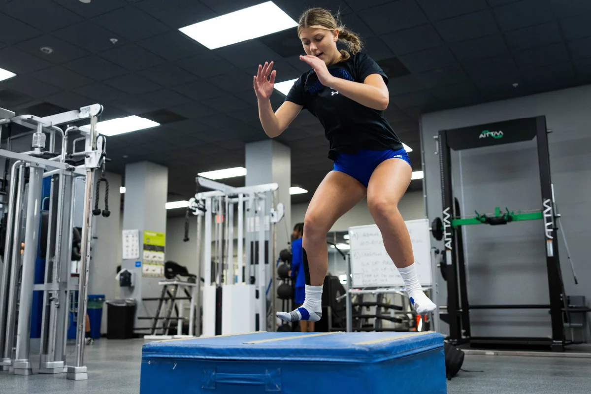An IMG Academy student-athlete performs box jumps