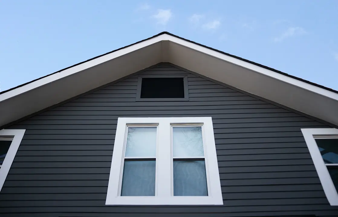 house with black lap siding