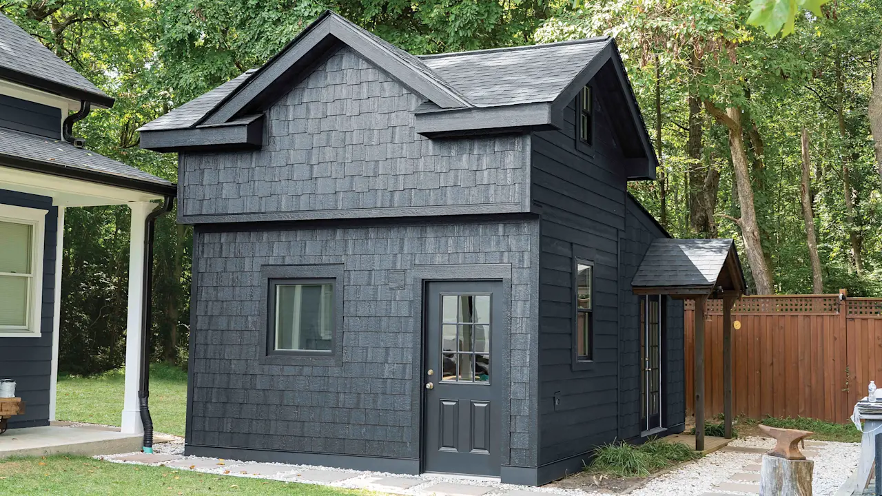 black house with cedar texture shake lap siding