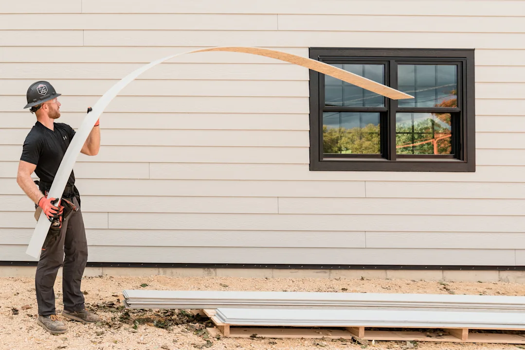 Influencer working on home with siding