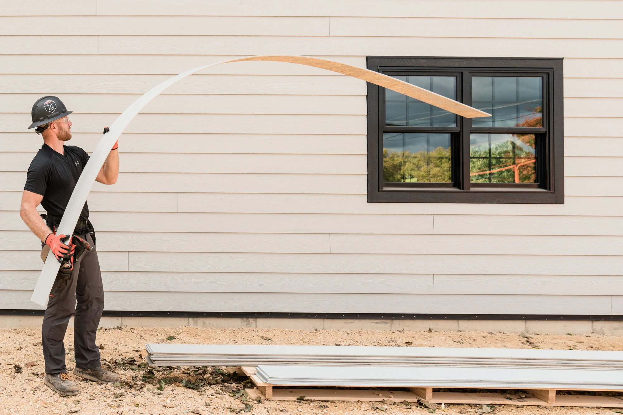 Influencer working on home with siding