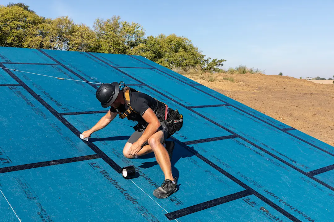 roofing professional working on a roof