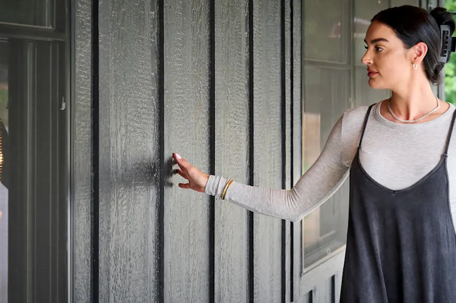 Claire touching siding