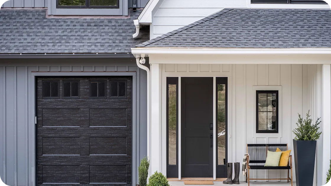 a home with gray and white vertical siding