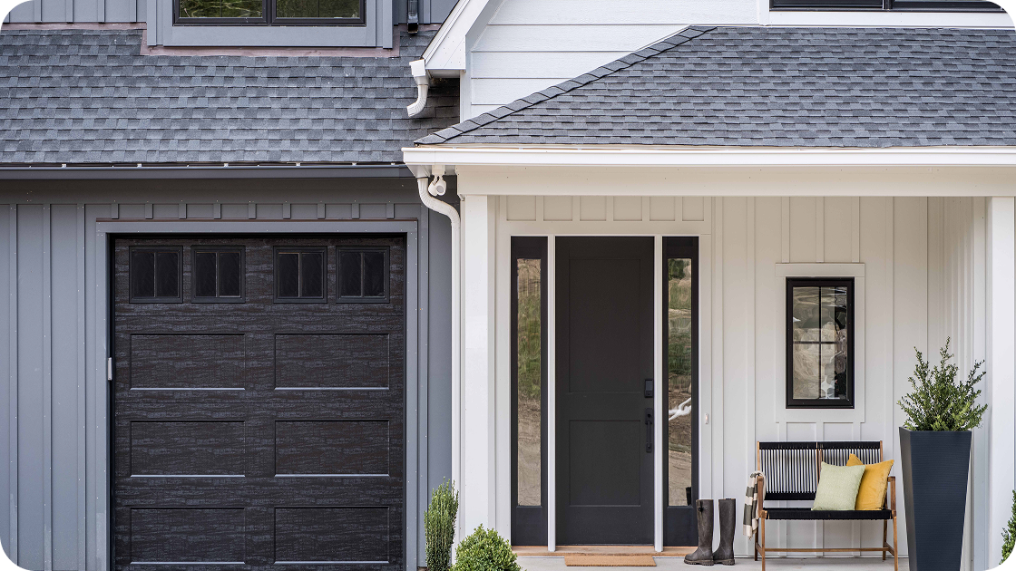 a home with gray and white vertical siding