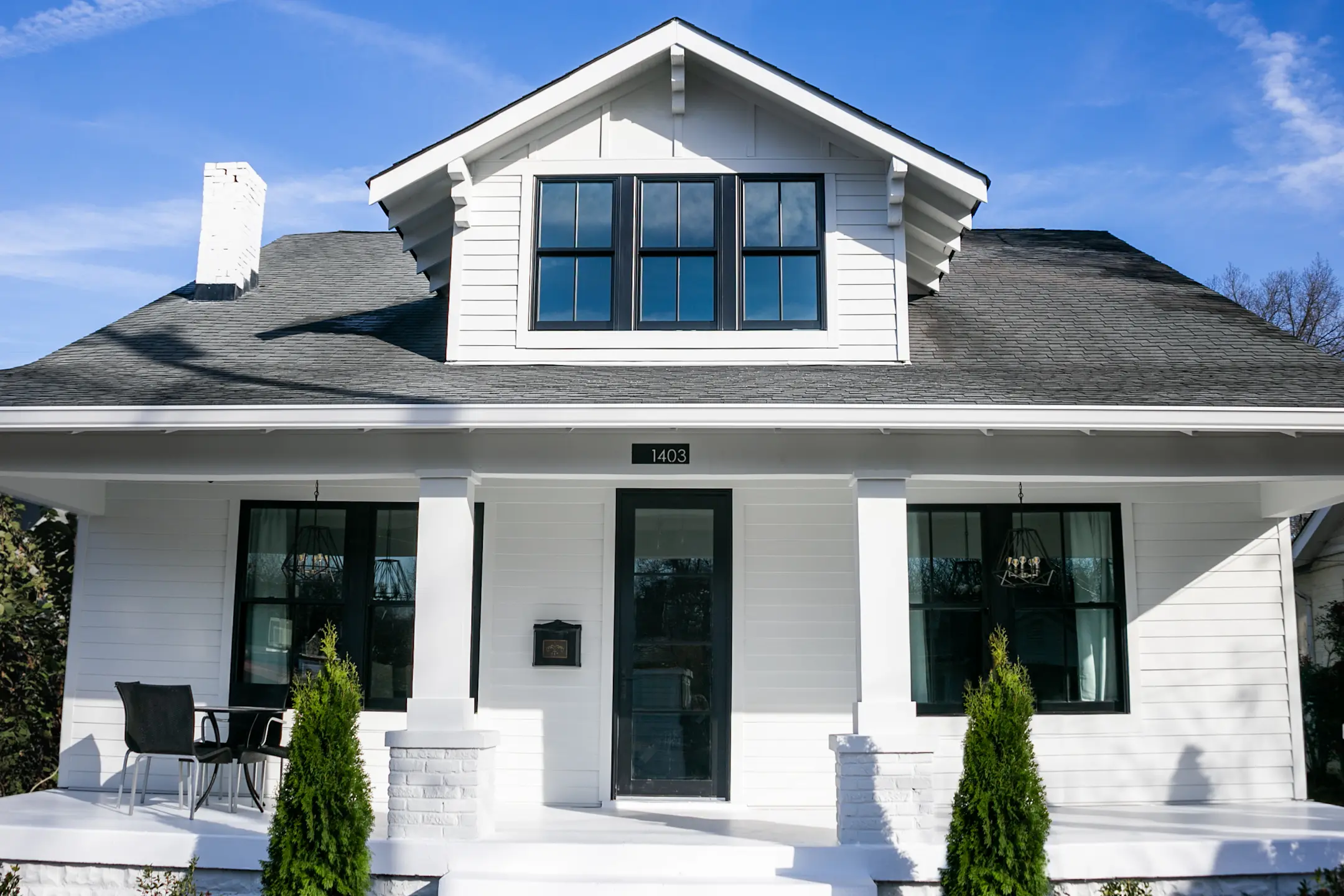 front view of a house with white lap siding