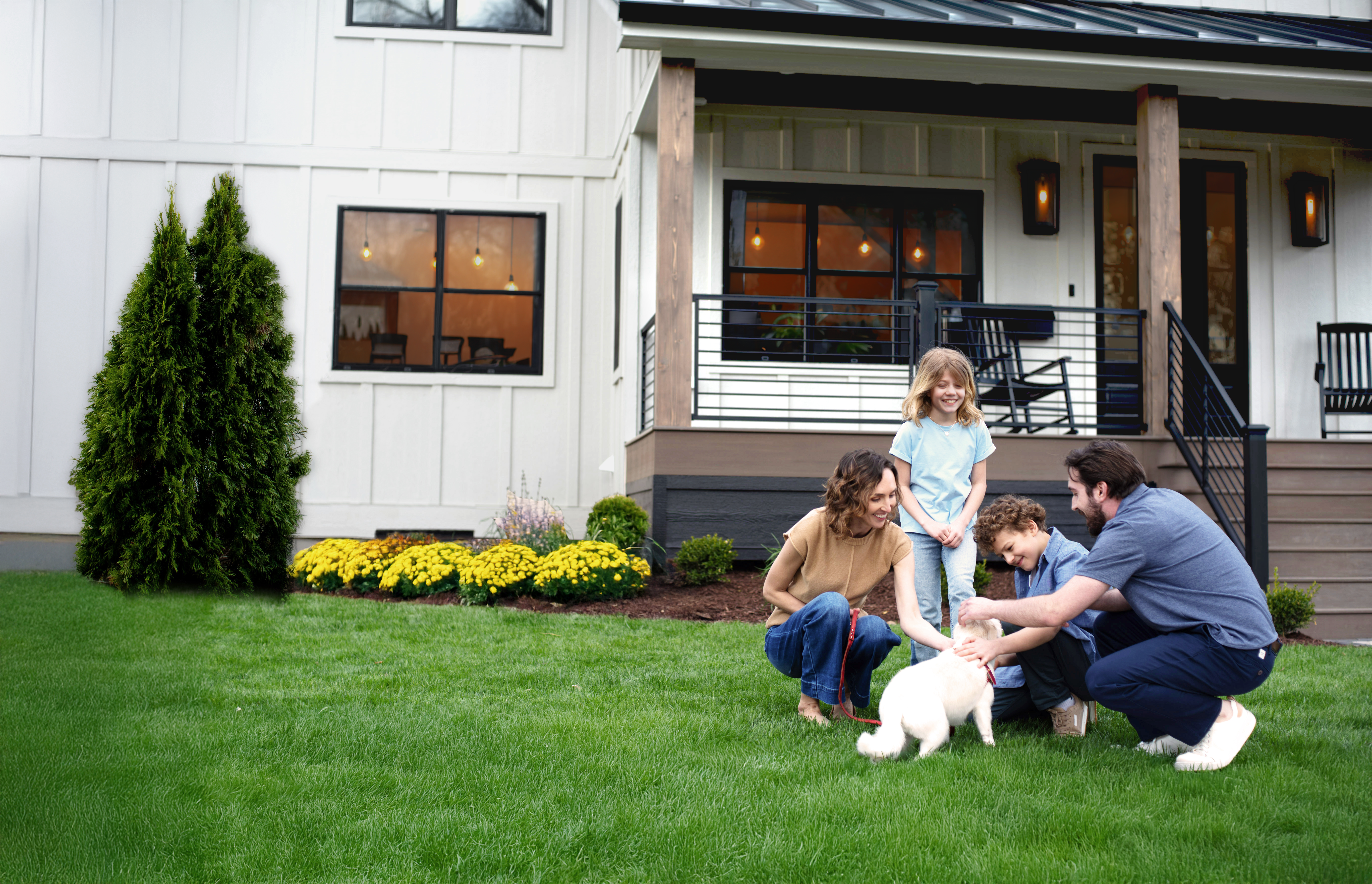 Image of a family in front of their home