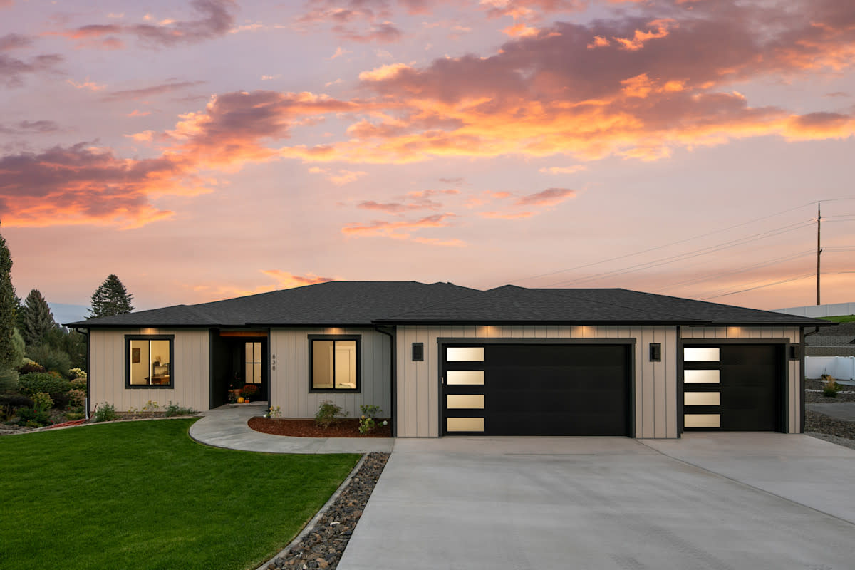 Image of a home in front of a sunset