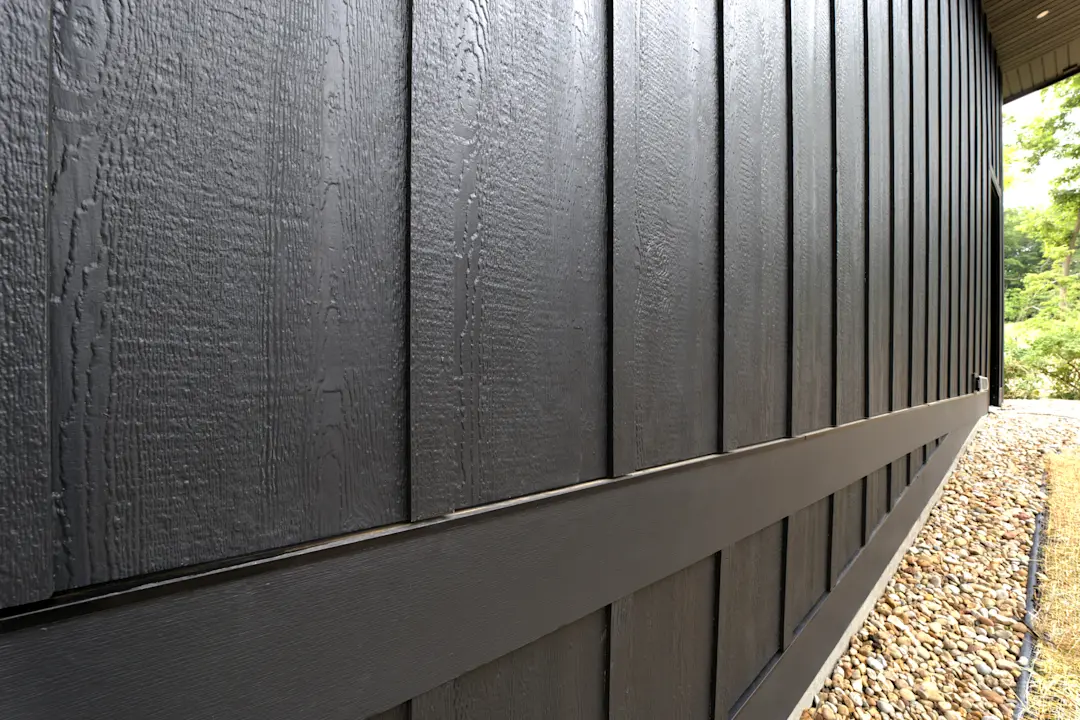 house with black siding in board and batten style