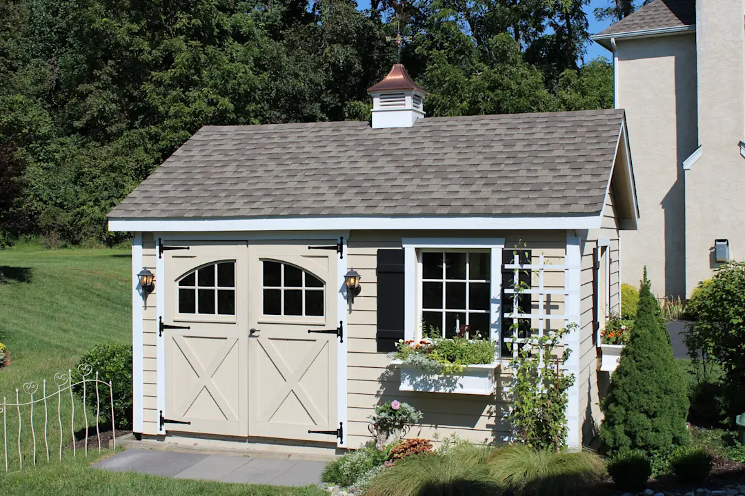 shed with tan lap siding